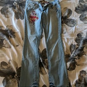 Jeans with dagger thru heart design